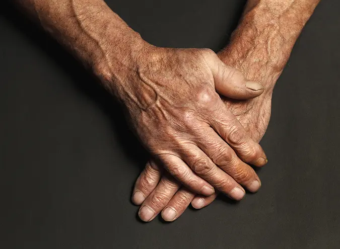 old mans hands representing onset of adam in number 1 testosterone booster article 2024