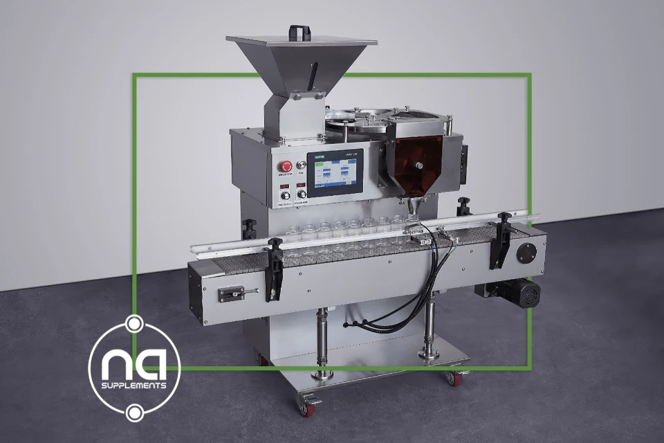 fully automatic pill counting machine stainless steel with a single discharge chute or header with integrated conveyor belt and dark green shaded border and na supplements logo