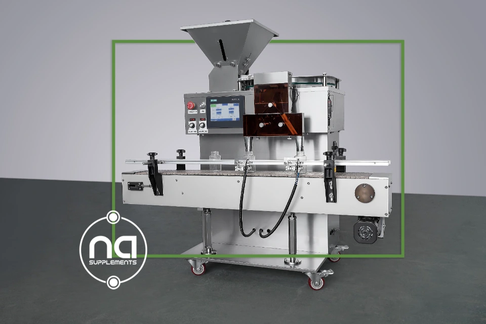fully automatic pill counting machine stainless steel with twin discharge chutes integrated conveyor belt and dark green shaded border and na supplements logo