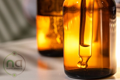 amber glass dropper bottle with na supplements watermark